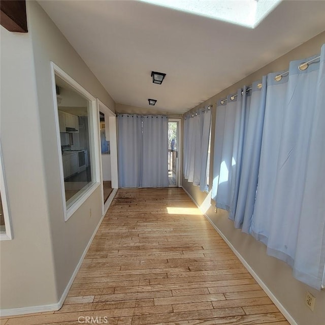 corridor featuring light hardwood / wood-style flooring