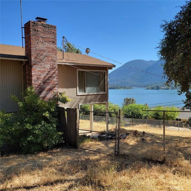 view of property exterior with a mountain view