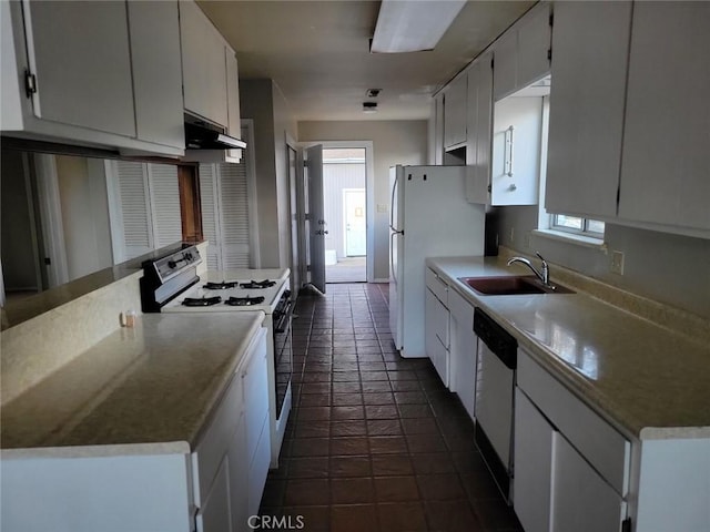 kitchen featuring white appliances, exhaust hood, white cabinets, sink, and a wealth of natural light