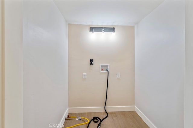 washroom with hookup for a washing machine and hardwood / wood-style floors