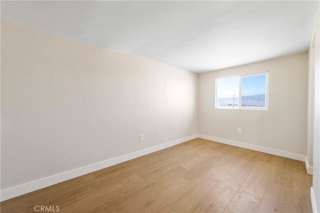 empty room with light hardwood / wood-style floors