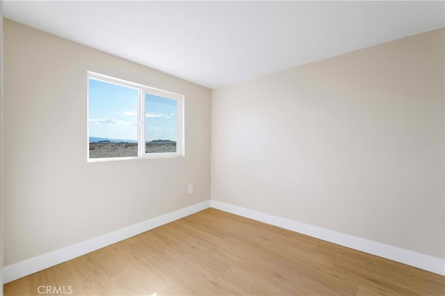 unfurnished room featuring wood-type flooring