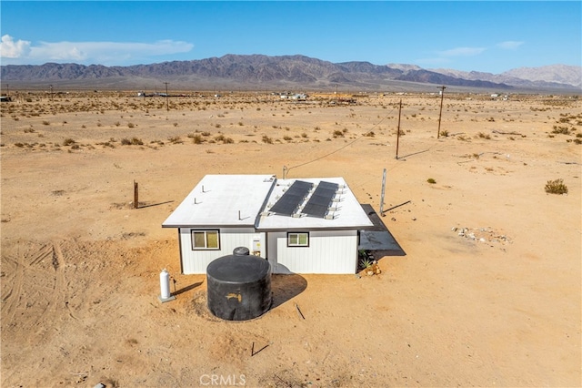 drone / aerial view featuring a mountain view