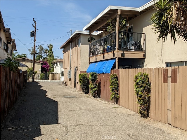 view of property exterior with a balcony