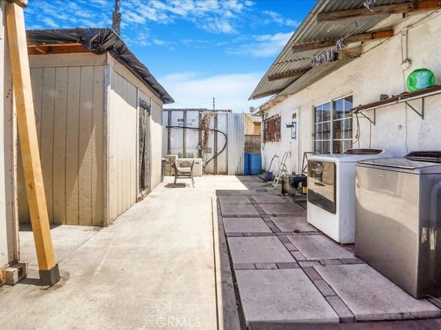 view of patio / terrace with washer and clothes dryer