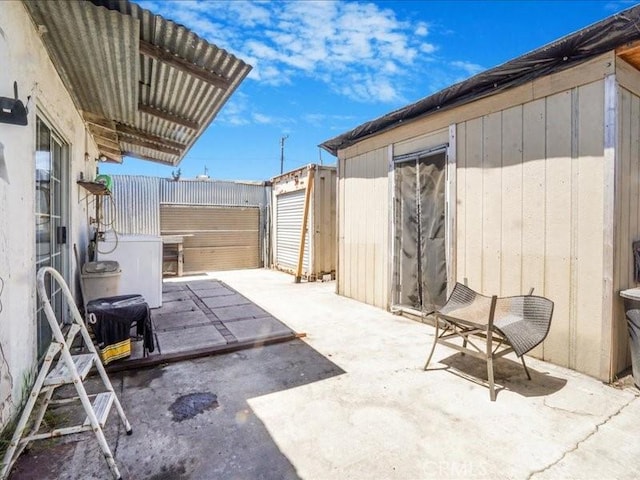 view of patio / terrace featuring a shed