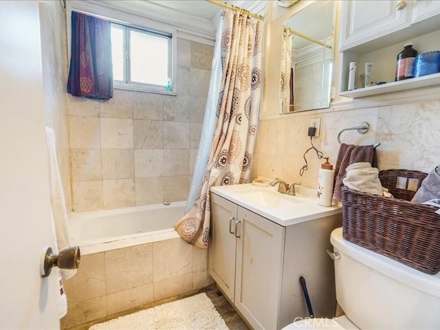 full bathroom with vanity, toilet, crown molding, and shower / tub combo