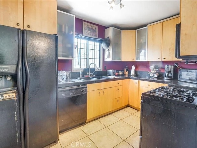 kitchen featuring black appliances, light tile patterned floors, sink, and light brown cabinetry