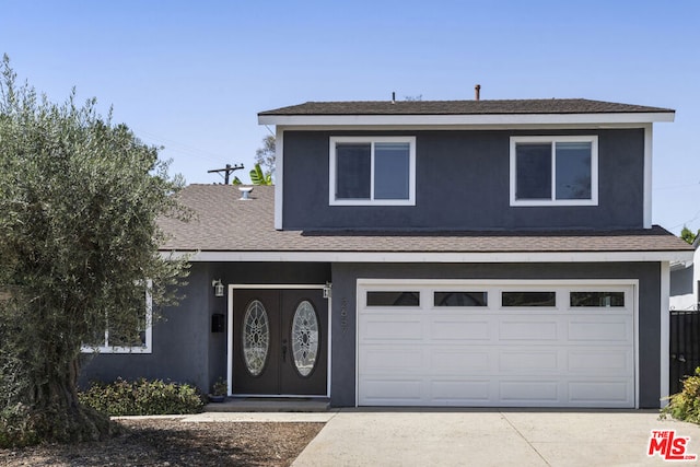 view of property featuring a garage