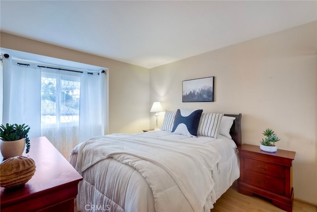 bedroom with light wood-type flooring