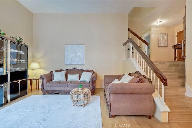 living room with light hardwood / wood-style flooring