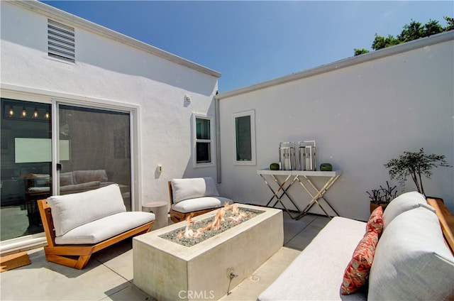 view of patio featuring an outdoor fire pit