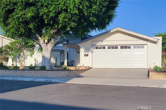 ranch-style house featuring a garage