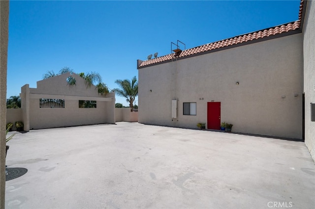 view of property exterior with a patio