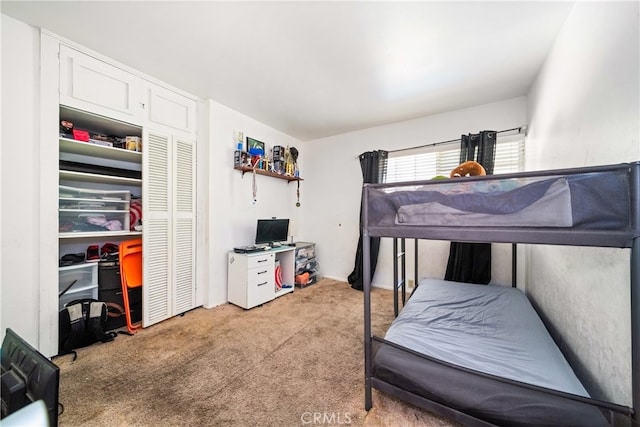 carpeted bedroom with a closet