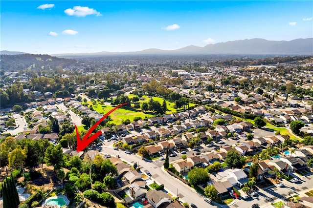 birds eye view of property featuring a mountain view