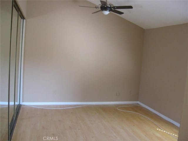 3431 Timber Lk Unit 46, Costa Mesa, CA 92626 - spare room featuring light wood-style floors, vaulted ceiling, baseboards, and ceiling fan