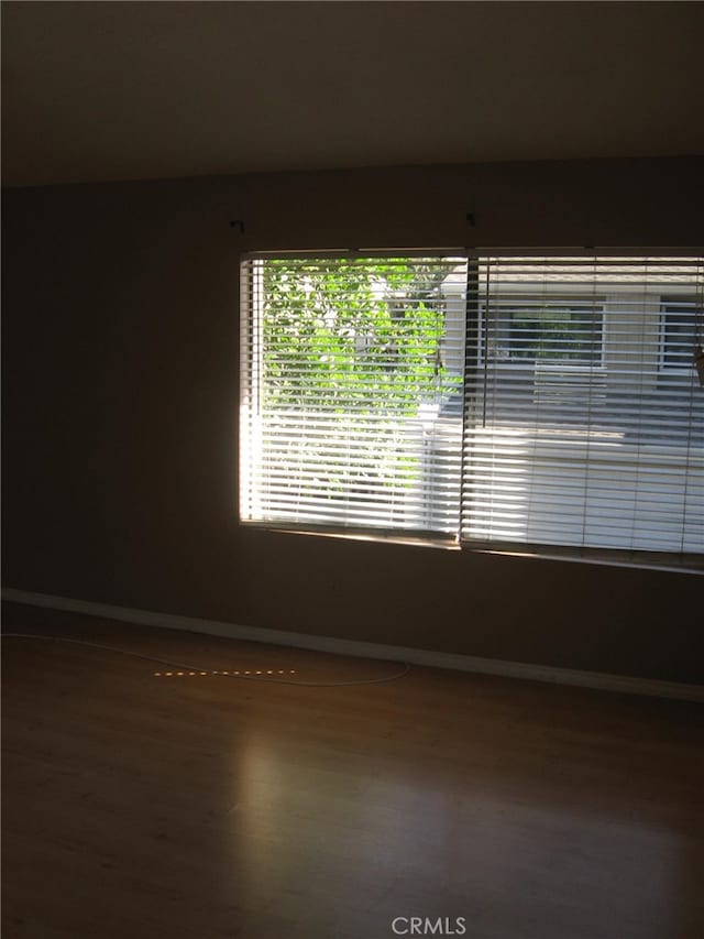 empty room with wood-type flooring