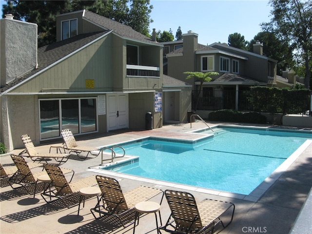 view of swimming pool featuring a patio