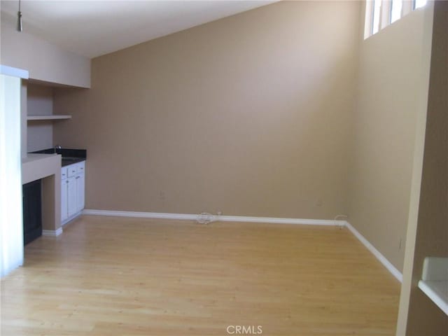 3431 Timber Lk Unit 46, Costa Mesa, CA 92626 - unfurnished dining area featuring light wood finished floors and baseboards
