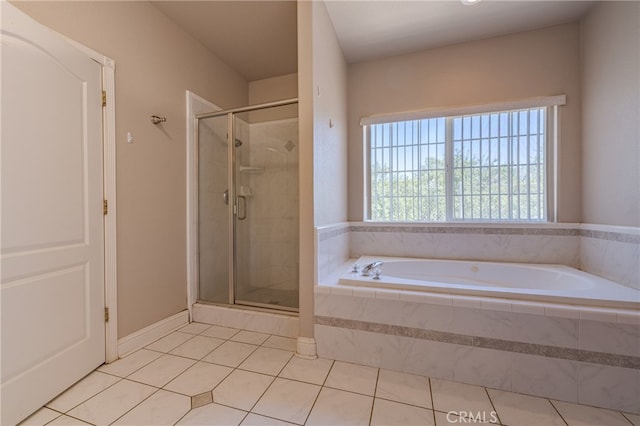 bathroom featuring shower with separate bathtub and tile patterned flooring