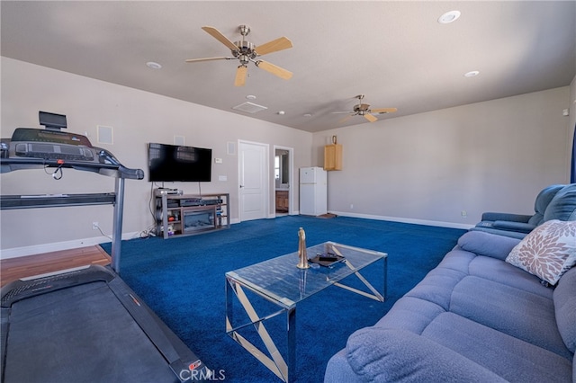 carpeted living room featuring ceiling fan