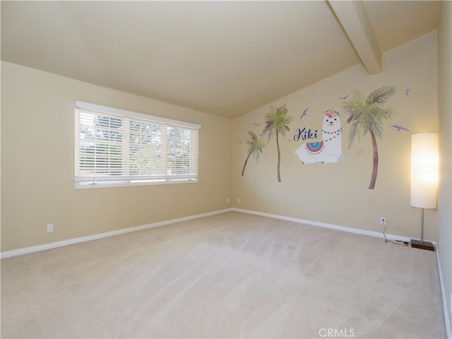 carpeted spare room featuring lofted ceiling with beams