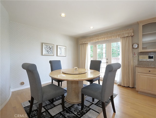 dining space featuring light wood-type flooring