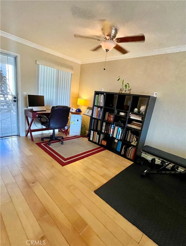 sitting room featuring ornamental molding, ceiling fan, and hardwood / wood-style floors