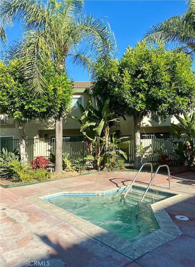 view of pool featuring a community hot tub