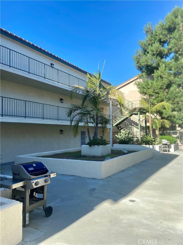 view of home's community with a patio