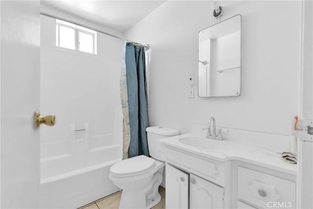 full bathroom featuring tile patterned flooring, vanity, toilet, and shower / bathtub combination with curtain