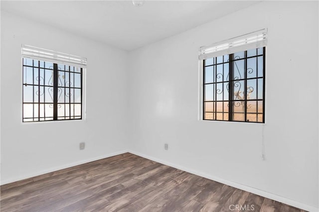 spare room featuring hardwood / wood-style floors