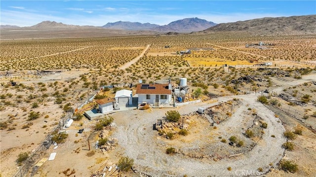 drone / aerial view featuring a mountain view and a rural view