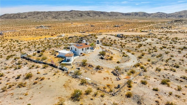 birds eye view of property featuring a mountain view