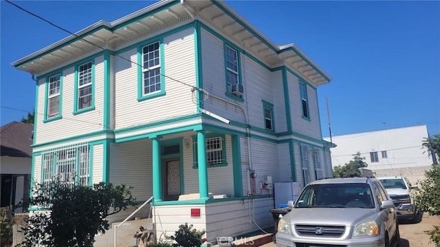 view of front facade featuring cooling unit and covered porch