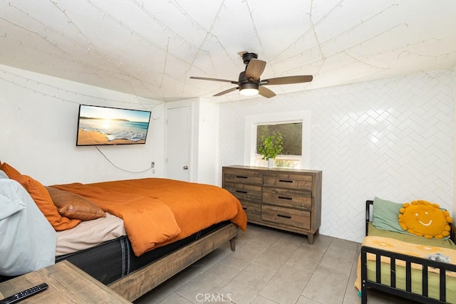 bedroom featuring ceiling fan and light tile patterned floors