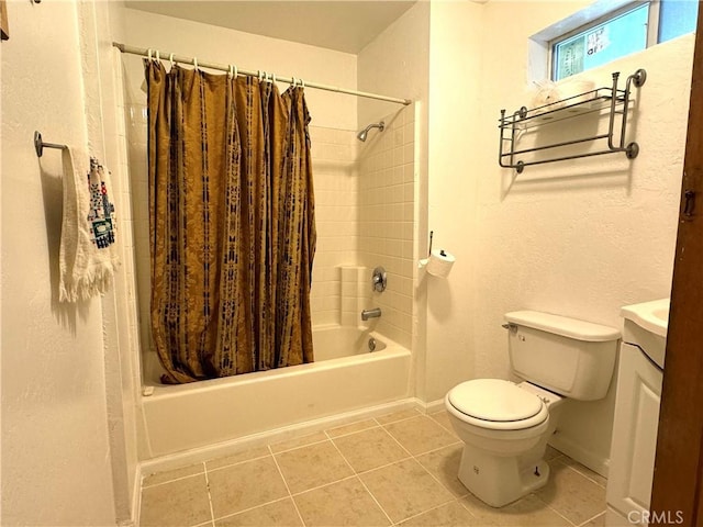 full bathroom with vanity, tile patterned floors, toilet, and shower / tub combo with curtain