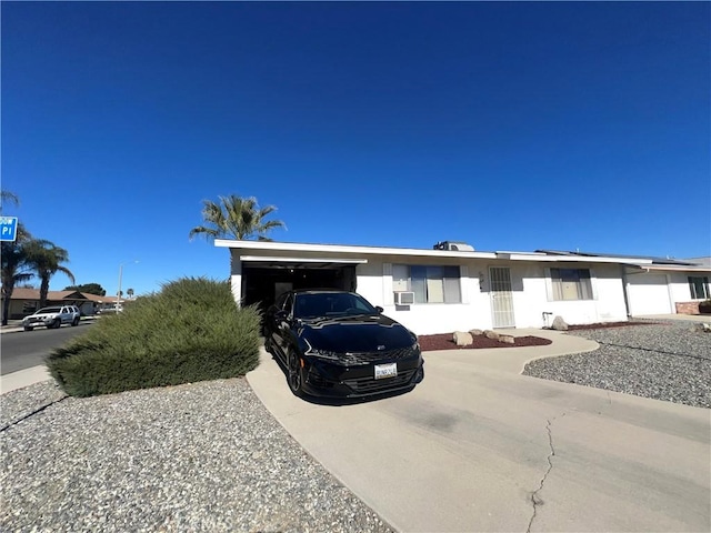 view of front of property featuring a carport