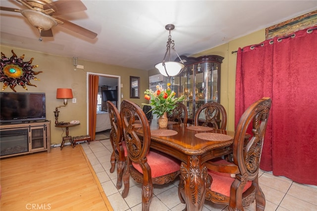 dining space featuring light hardwood / wood-style flooring and ceiling fan