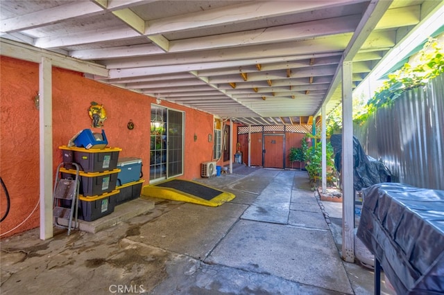 view of patio featuring a shed