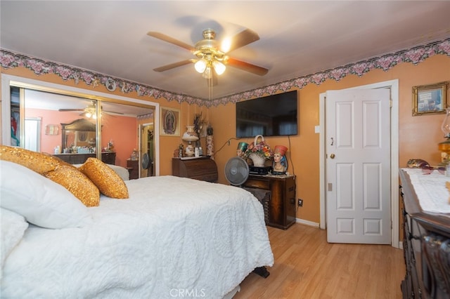 bedroom featuring a closet, ceiling fan, and light hardwood / wood-style floors