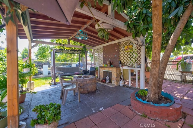 view of patio / terrace with an outdoor fire pit