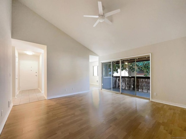 interior space featuring light hardwood / wood-style floors, high vaulted ceiling, and ceiling fan