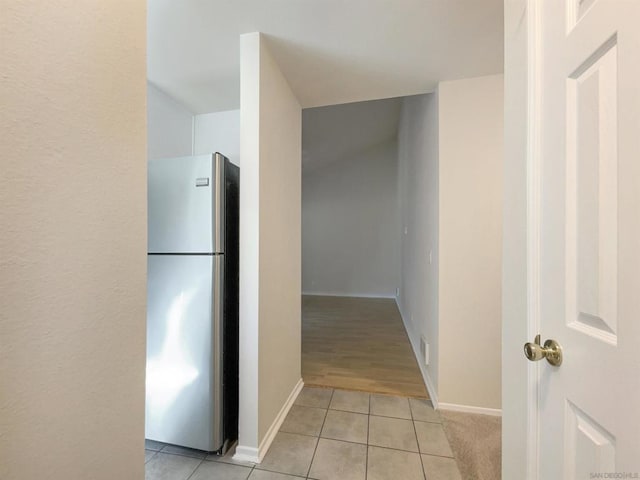 corridor featuring light tile patterned flooring