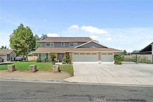 view of front of house with a garage and a front yard