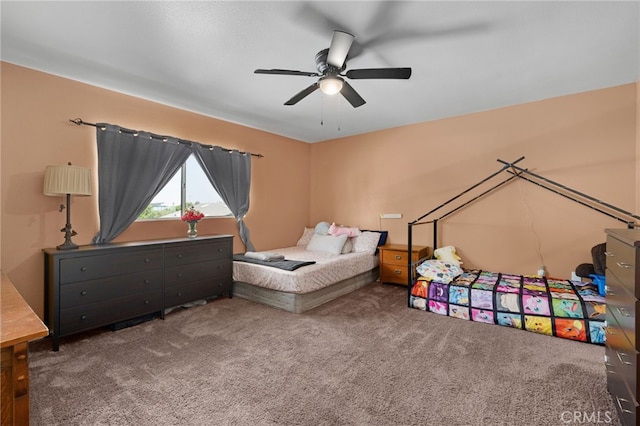 bedroom with ceiling fan and carpet floors