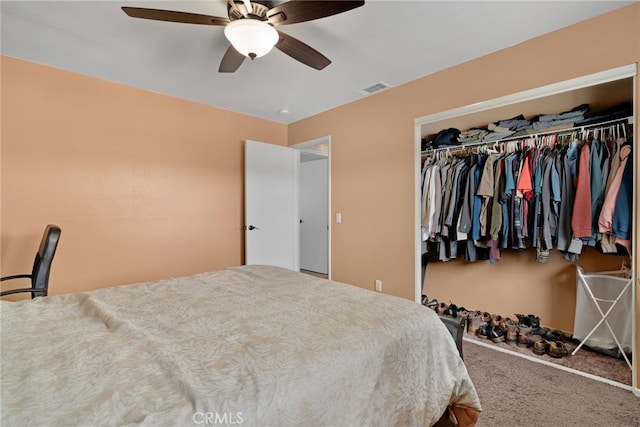 bedroom featuring ceiling fan, a closet, and carpet floors