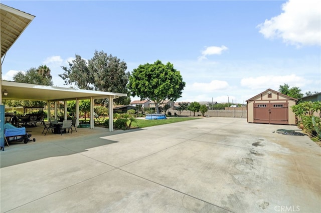 view of patio with a storage shed