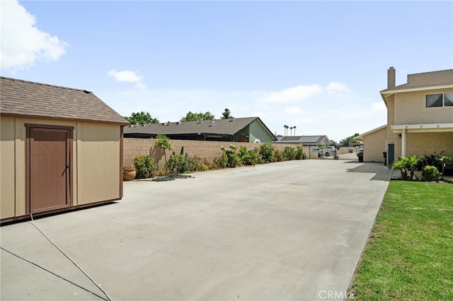 view of patio / terrace with a shed